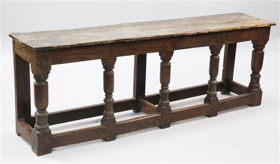 An early 18th century style oak long stool, W.5ft 6in. D.1ft 1in. H.1ft 11in